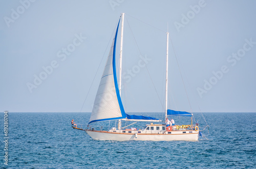 Sailing yacht in the blue calm sea.