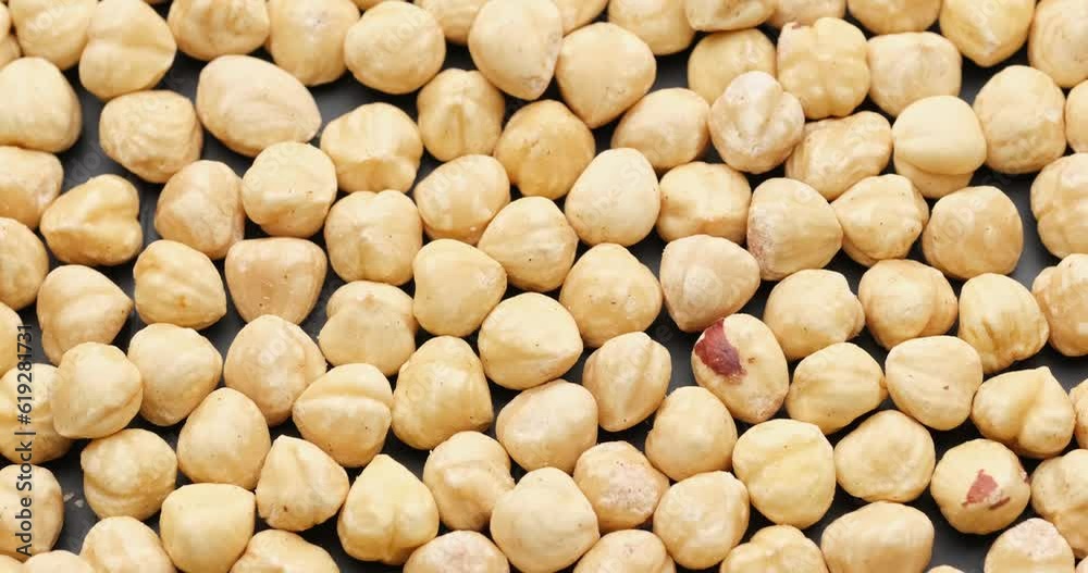 Whole shelled hazelnuts nuts kernels close-up on rotating platform Whole shelled hazelnuts nuts kernels close-up on rotating platform
