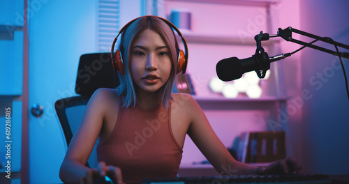 Asian young Esport woman gamer play online game on PC