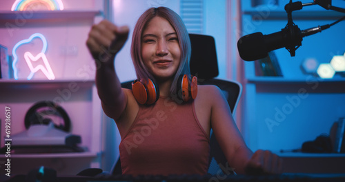 Asian young Esport woman gamer enjoy to play online game on pc