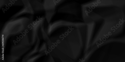 Black fabric texture and Crumpled black paper for background image. top view. black satin background