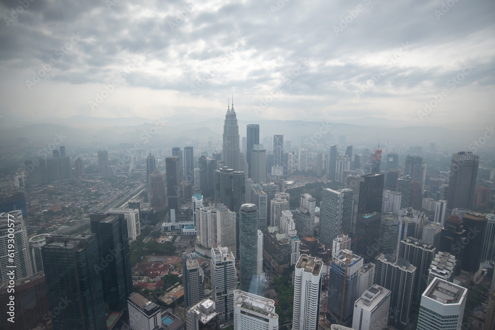 From an aerial perspective, Kuala Lumpur showcases its iconic Petronas Towers, bustling streets, parks, and a fusion of modern architecture and tropical greenery