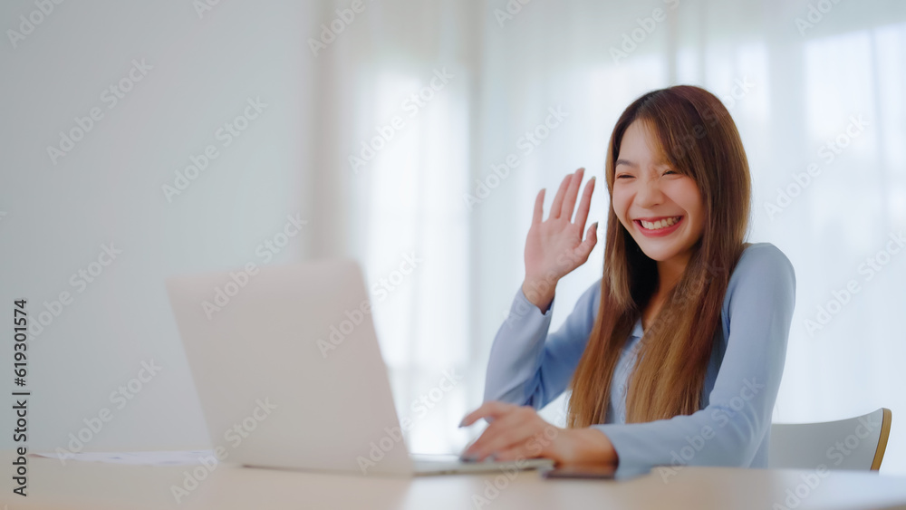 Young asian woman working on computer laptop at house. Work at home, Video conference, Video call, Student learning online class, meeting conference Young asian woman working on computer laptop at house. Work at home, Video conference, Video call, Student learning online class, meeting conference