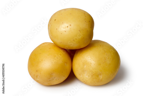 Natural organic potatoes on a white background. Whole raw potato tubers close-up.