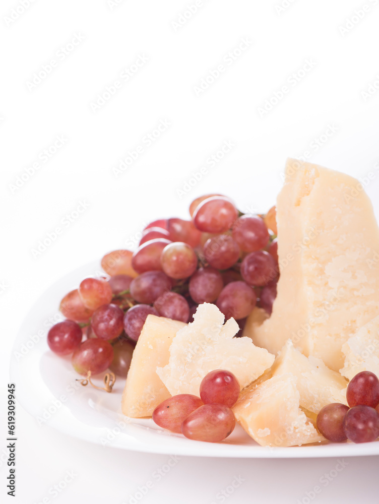 grapes and parmesan. Parmesan cheese and grapes isolated on a white backgroun. View from above grapes and parmesan. Parmesan cheese and grapes isolated on a white backgroun. View from above
