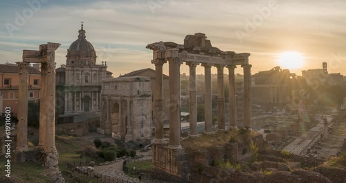 Morning time-lapse of historic Roman Forum ruins. Sunrise over Forum Romanum famous ancient travel landmark of Rome, Italy. Archaeological site and popular tourist attraction in center of the city.