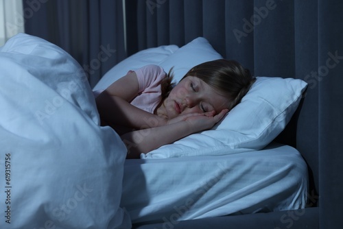 Little girl snoring while sleeping in bed at home