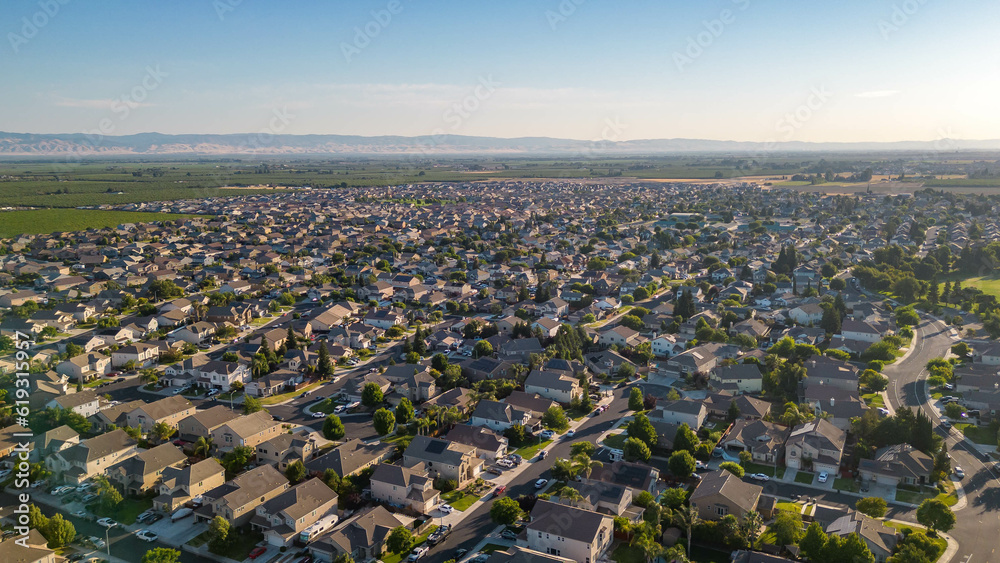 Breathtaking drone photos capture the stunning landscapes of Manteca, California, showcasing its charming houses nestled amidst picturesque surroundings.