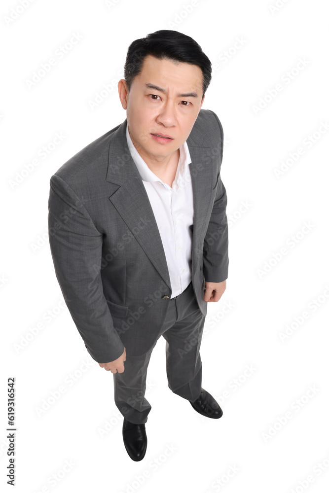Angry businessman in suit posing on white background, above view