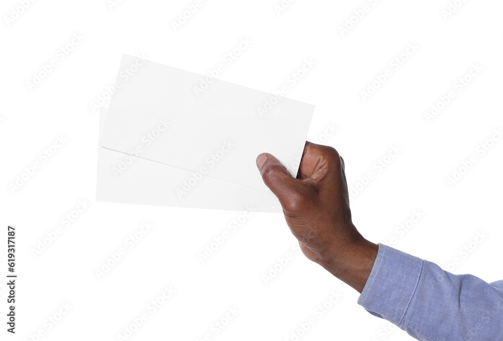 Fototapeta premium African American man holding flyers on white background, closeup. Mockup for design