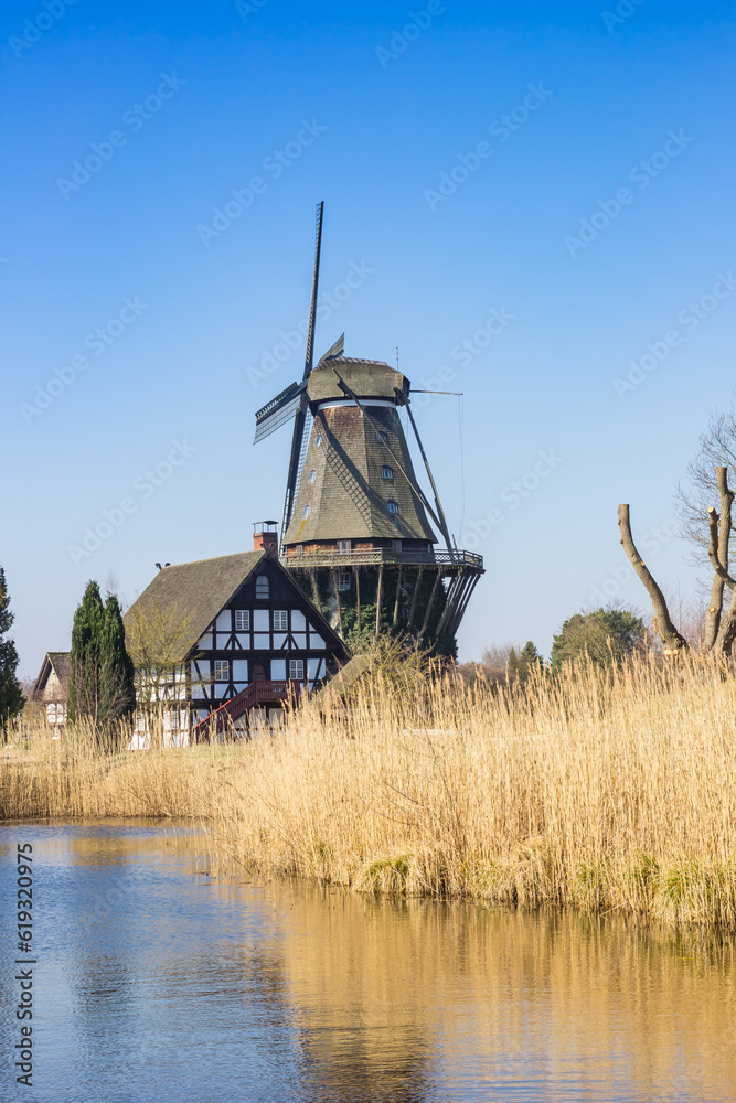 Historic windmill and half-timbered house in Gifhorn, Germany