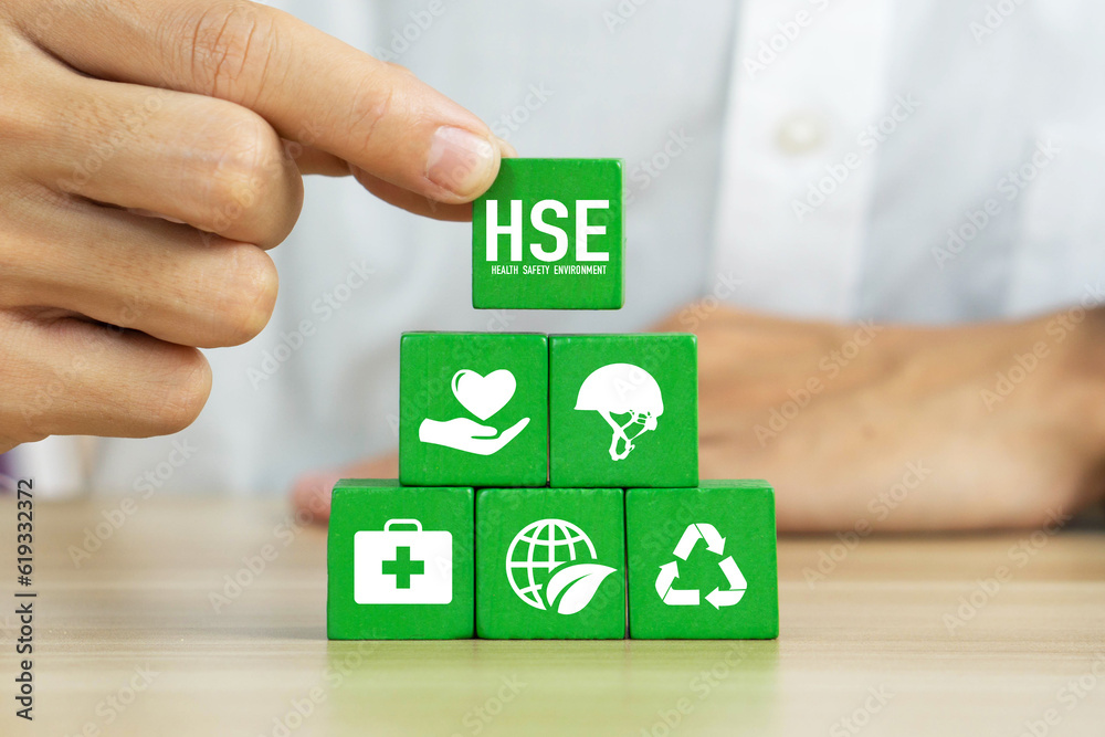 HSE Health Safety Environment Concept Hand Holding Wooden Cube Block 