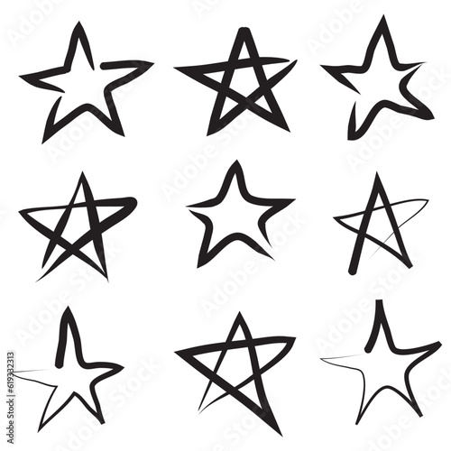 Set of black hand drawn doodle stars in isolated on white background.
