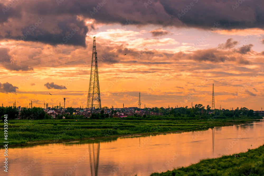 Landscape of the river at sunset with a beautiful cloudy sky.