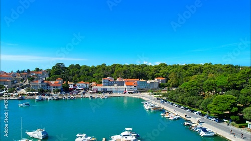 Rab - Croatia - An aerial view with the drone over the beautiful town of Rab - The drone rises above the town of Rab and the marina and opens up a fantastic view of the Croatian islands