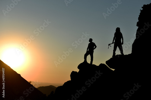Victory of fellow travelers watching the sunrise on the summit