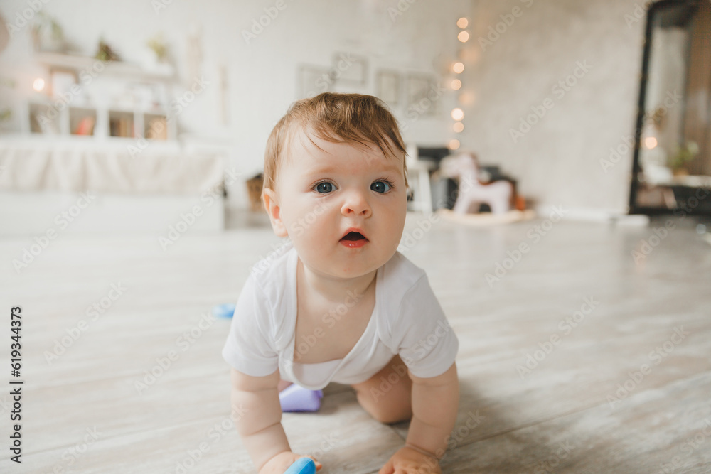 crawling baby 6 months in the nursery at home. crawling baby 6 months in the nursery at home.