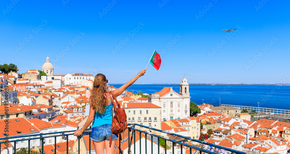 Woman with portuguese flag enjoying travel in Lisbon, Portugal
