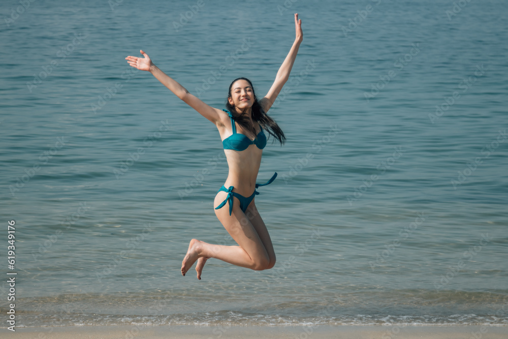 happy girl in freedom jumping on the beach happy girl in freedom jumping on the beach