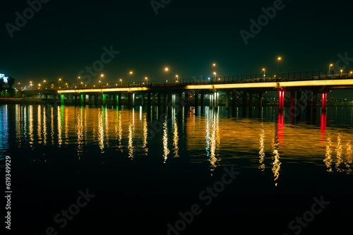 This is a bridge over Sabarmati river located in Ahmedabad. The reflection of the bridge on water.