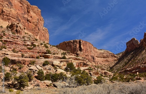 dramatic red rock formations on a sunny winter day in the san rafael river canyon along the buckhorn draw scenic byway in the northern san rafael swell near green river, utah 