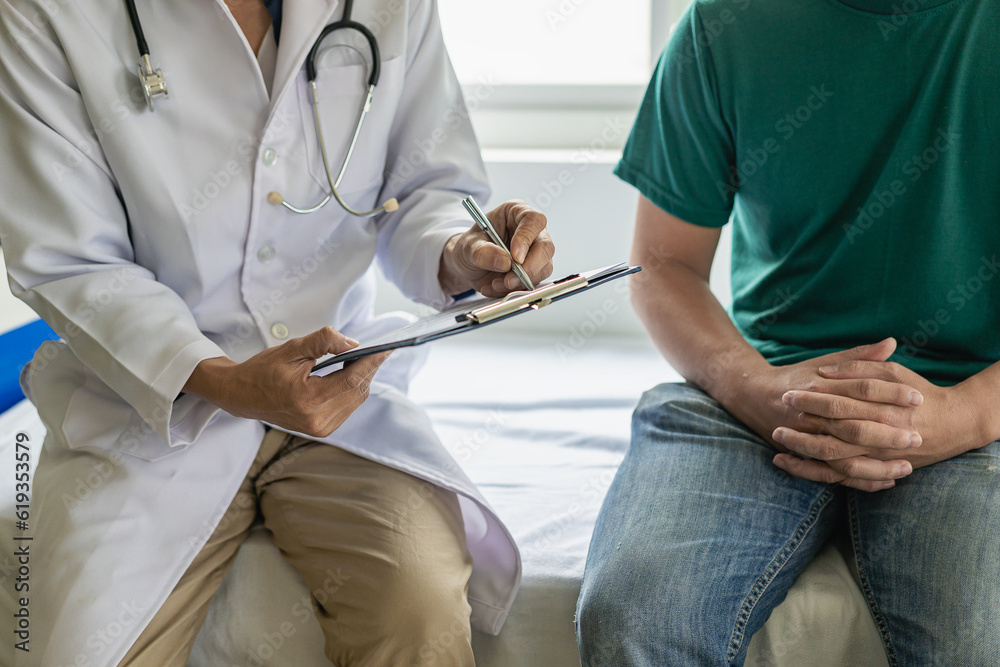 Doctor talking to patient and filling patient history. Examination, treatment. Medical and health concept. Men's disease prevention, health, medical services, consultation, Doctor talking to patient and filling patient history. Examination, treatment. Medical and health concept. Men's disease prevention, health, medical services, consultation,