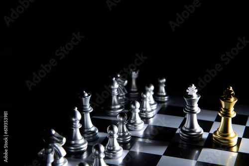 hand of businessman wearing suit moving chess using strategic challenge idea , business competition planing teamwork strategic concept.