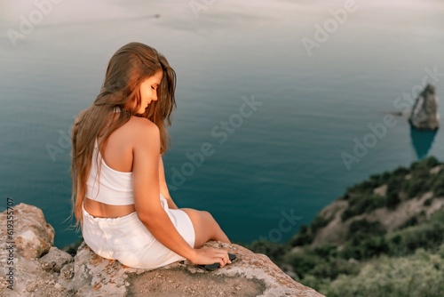 Portrait of a happy woman in a cap with long hair against the sea © svetograph