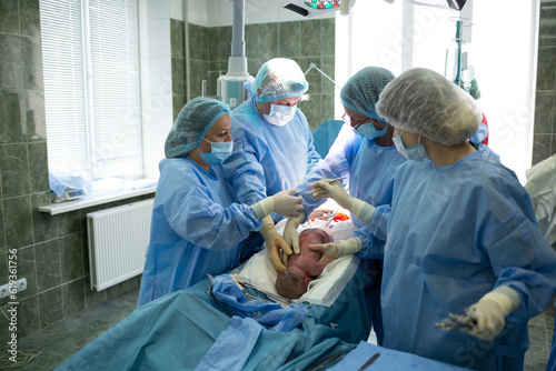 a group of doctors during cesarean births.