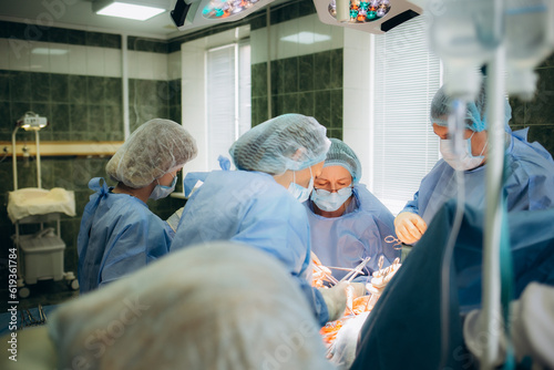 a group of doctors during cesarean births.