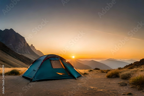  camping tent high in the mountains at sunset