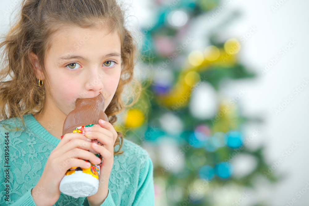 a little girl eating chocolate a little girl eating chocolate