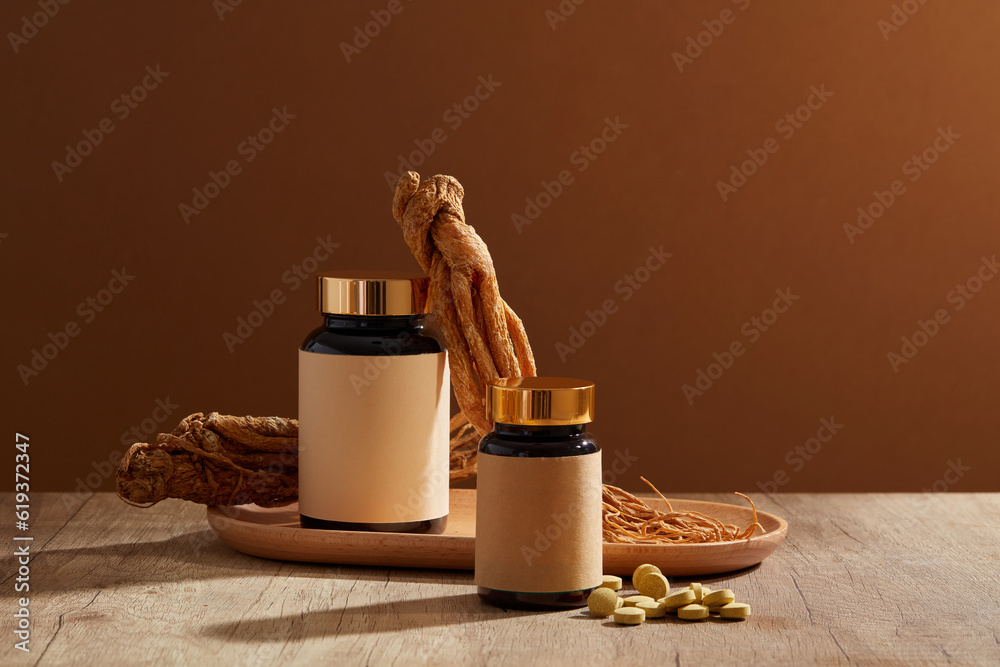Two unlabeled glass jars decorated with a wooden tray of Angelica root