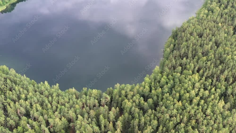 Drone flies over the forest and lake 4k movie. European nature landscapes concept Drone flies over the forest and lake 4k movie. European nature landscapes concept