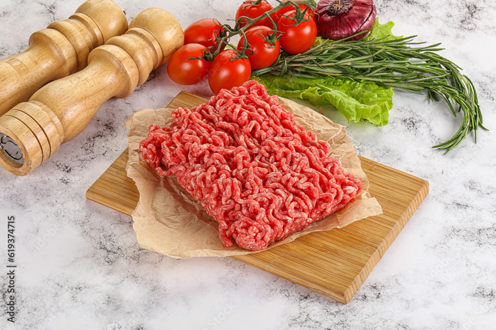Raw minced beef meat on cutting board Raw minced beef meat on cutting board