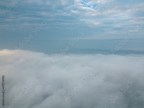 Landscape aerial view of the city skyline with white clouds