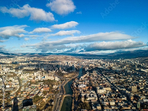 Aerial view of the cityscape with a cloudy blue sky in the background, Tbilisi, Georgia