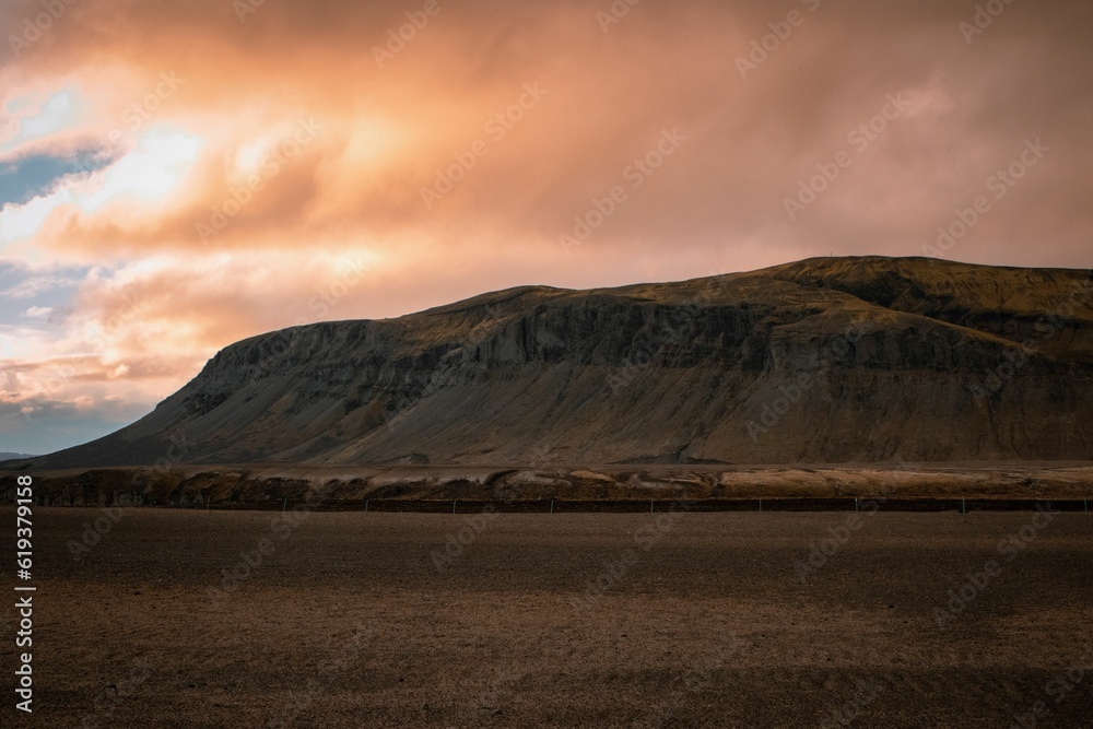 Breathtaking view of the Icelandic mountains of the Golden Circle, illuminated by a glowing sunset