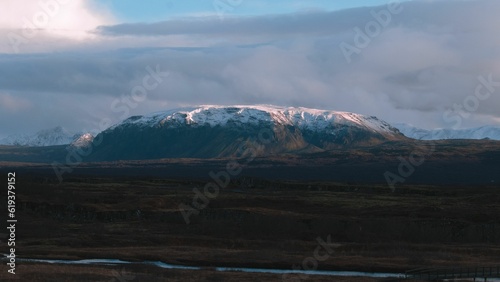 Wallpaper Mural Stunning view of the majestic mountain peaks, with a narrow river flowing on the foreground Torontodigital.ca