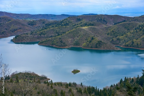 Smaller section of Lake Plastiras surrounded by green hills. Karditsa, Greece.