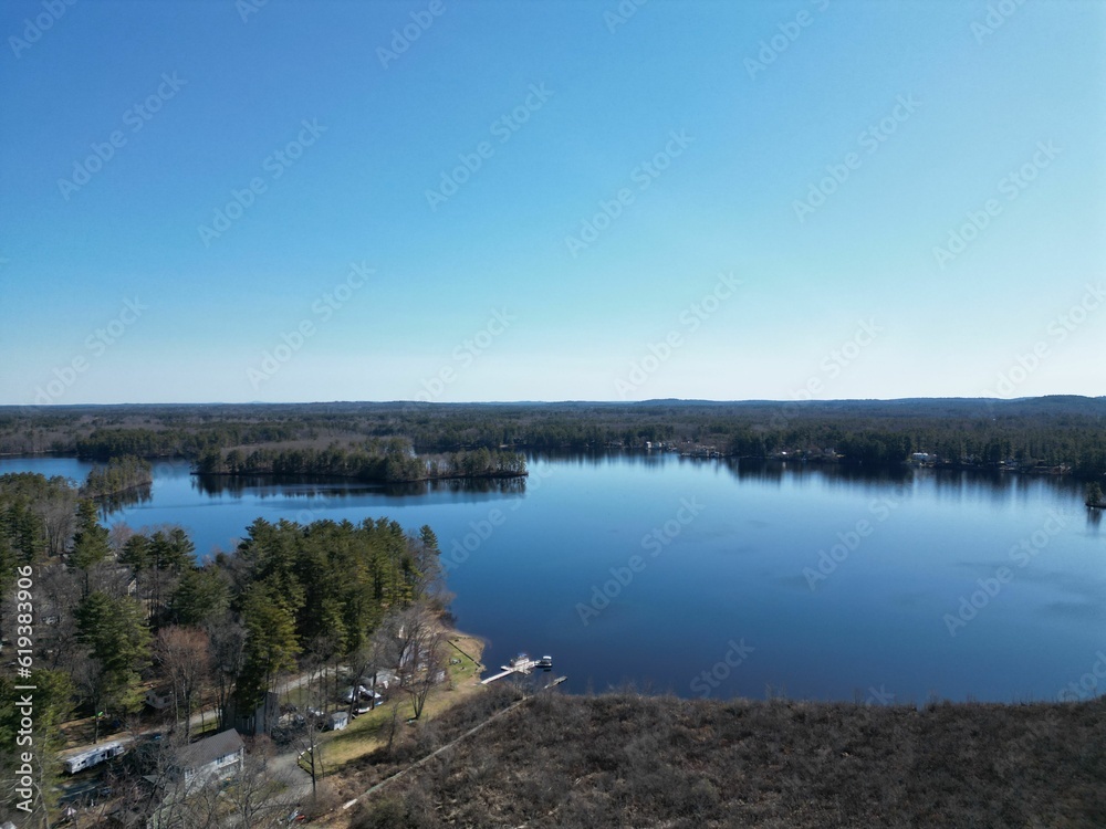 Aerial view of the serene Kingston Lake on a sunny day in Kingston,NH