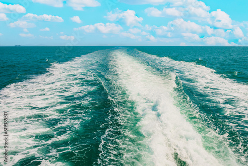 Wave from speed boat on blue sea and clouds © Pavlo Vakhrushev