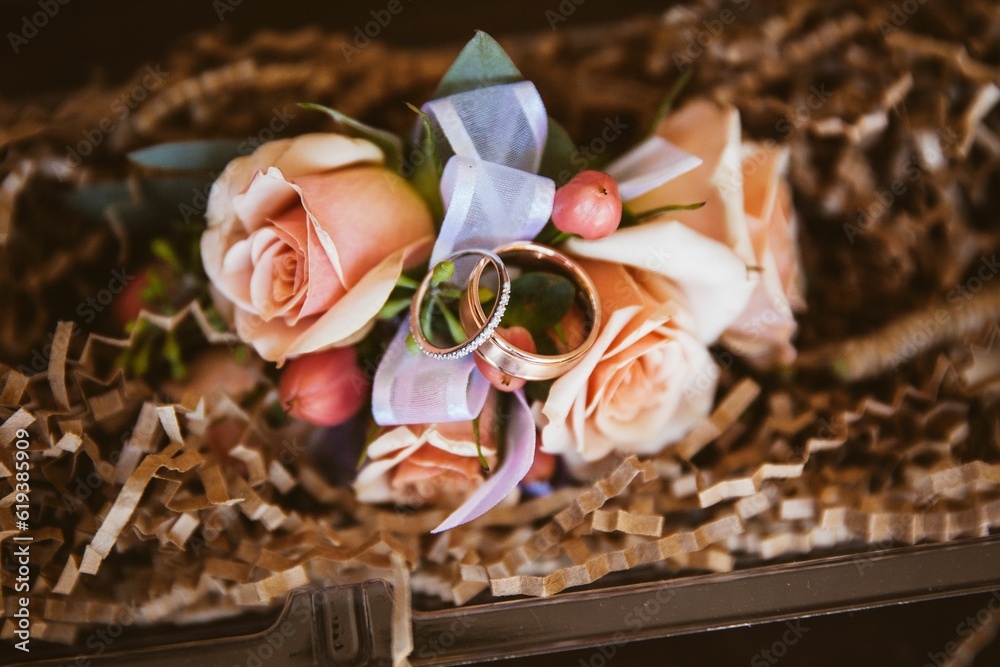 Vibrant bouquet of flowers in a wooden box, with sparkling diamond engagement rings