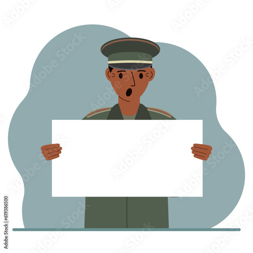 A military man in uniform holds a white sheet of paper in his hands. Concept for advertising, poster, banner.