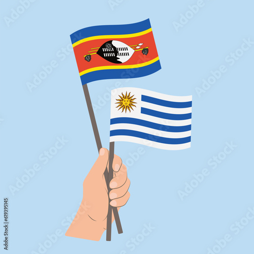 Flags of Eswatini and Uruguay, Hand Holding flags