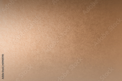 Bright natural soft light brown tone color gradation paint on recycled cardboard box blank environmental friendly paper texture background minimal style with space