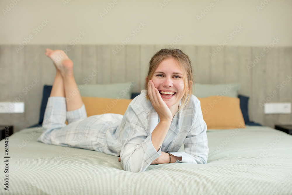young pretty woman feeling happy and astonished at something unbelievable. nightwear concept young pretty woman feeling happy and astonished at something unbelievable. nightwear concept