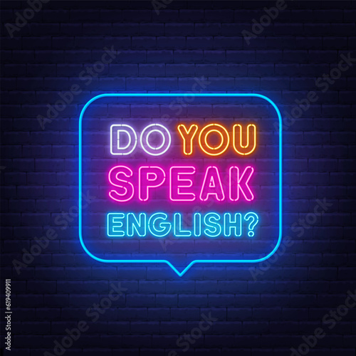 Do You Speak English neon sign in the speech bubble on brick wall background.