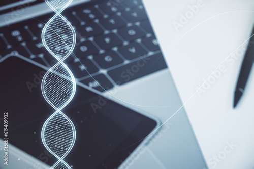 Double exposure of creative DNA hologram on laptop background. Bio Engineering and DNA Research concept © Pixels Hunter