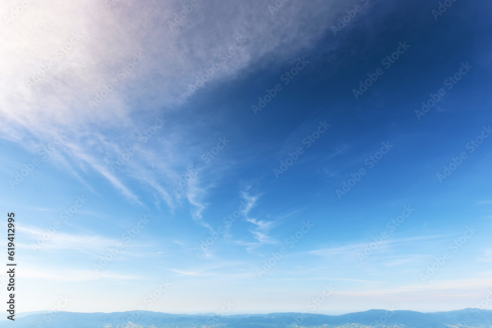 blue sky with fluffy clouds on a sunny day. beautiful nature background blue sky with fluffy clouds on a sunny day. beautiful nature background